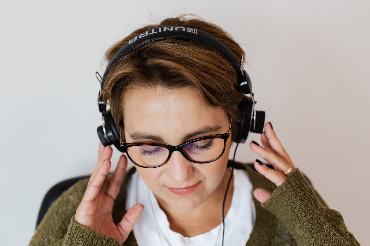 woman listening to music - the stress paradox