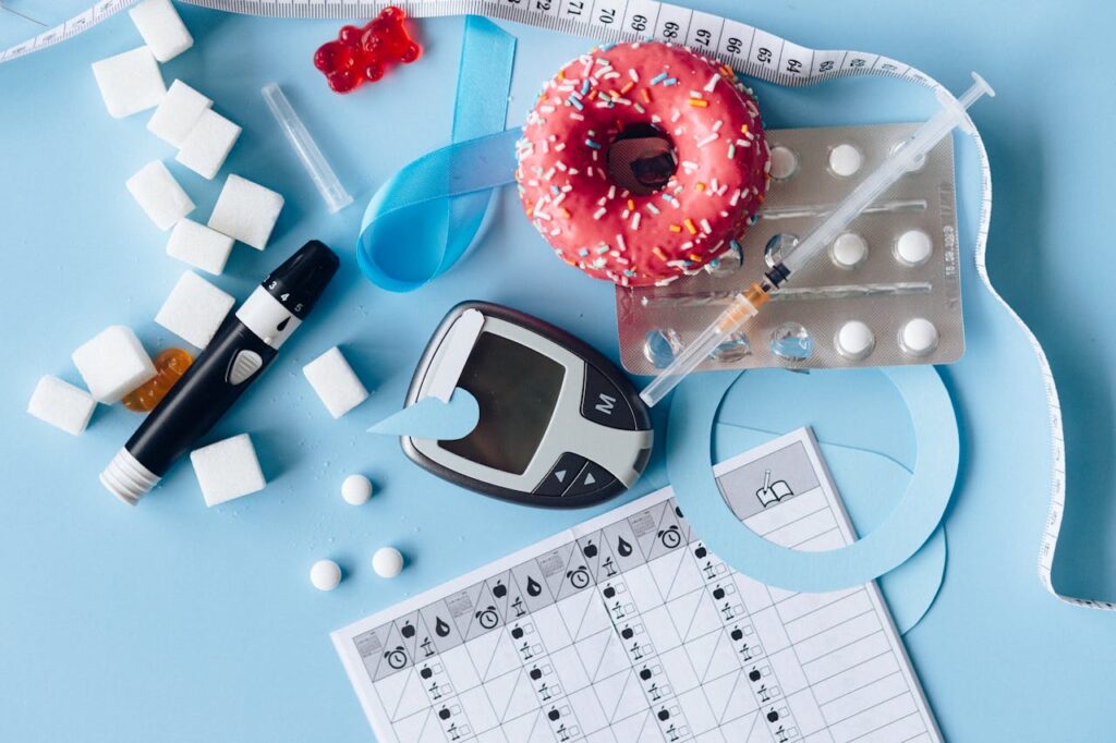 glucose monitor, meds, sugar cubes, donut - How to Prevent and Reverse Diabetes Naturally