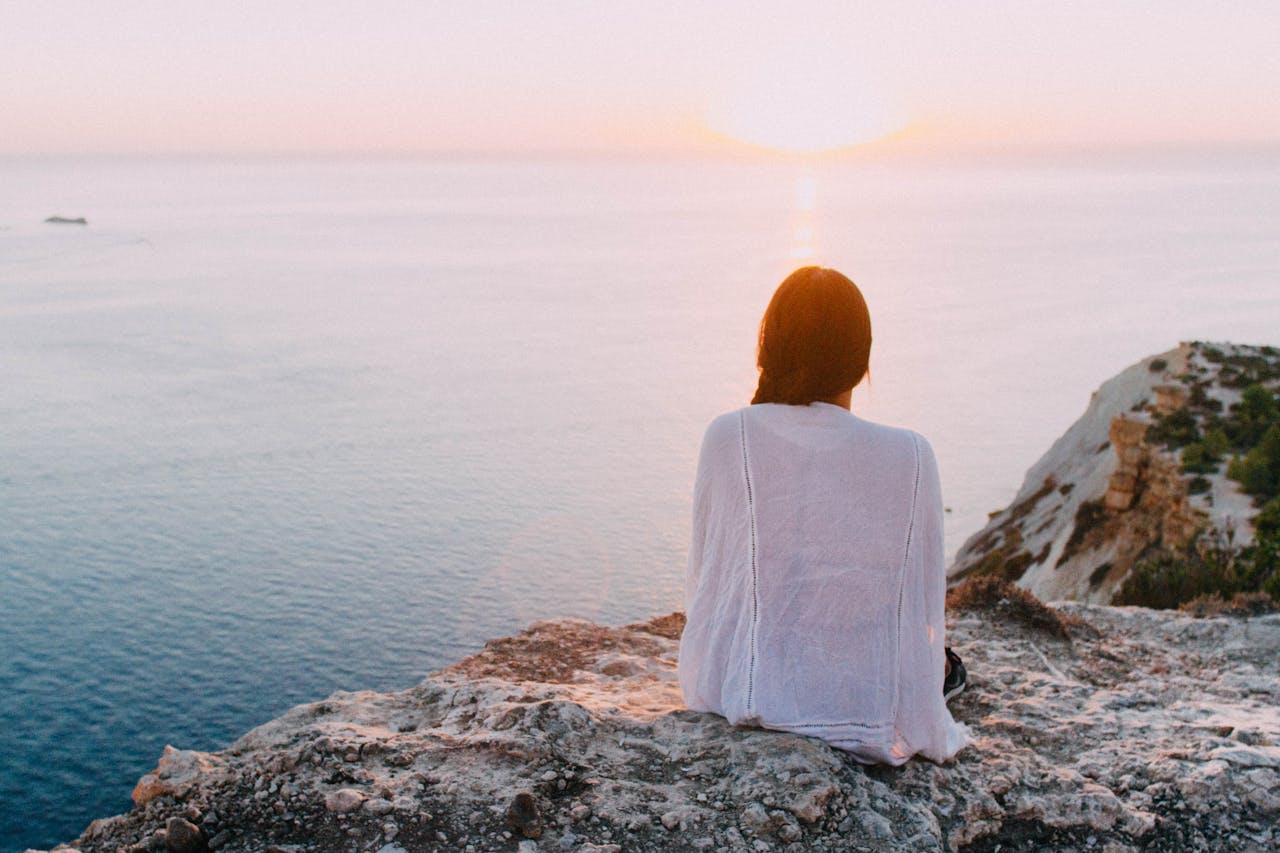 woman looking at ocean - rethinking mental health
