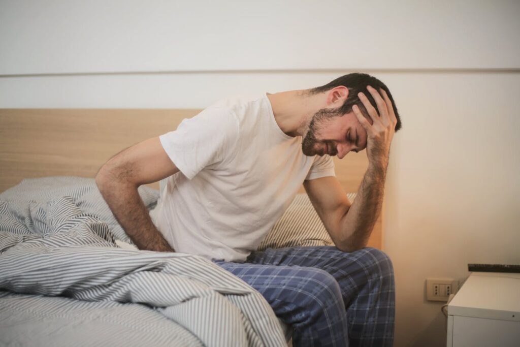 person with headache - infections when to seek medical care