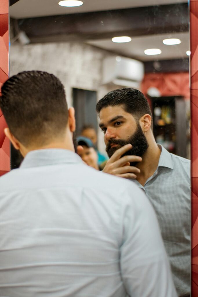 man looking at self in mirror - Self-Image is the Biggest Predictor of Your Long-Term Health
