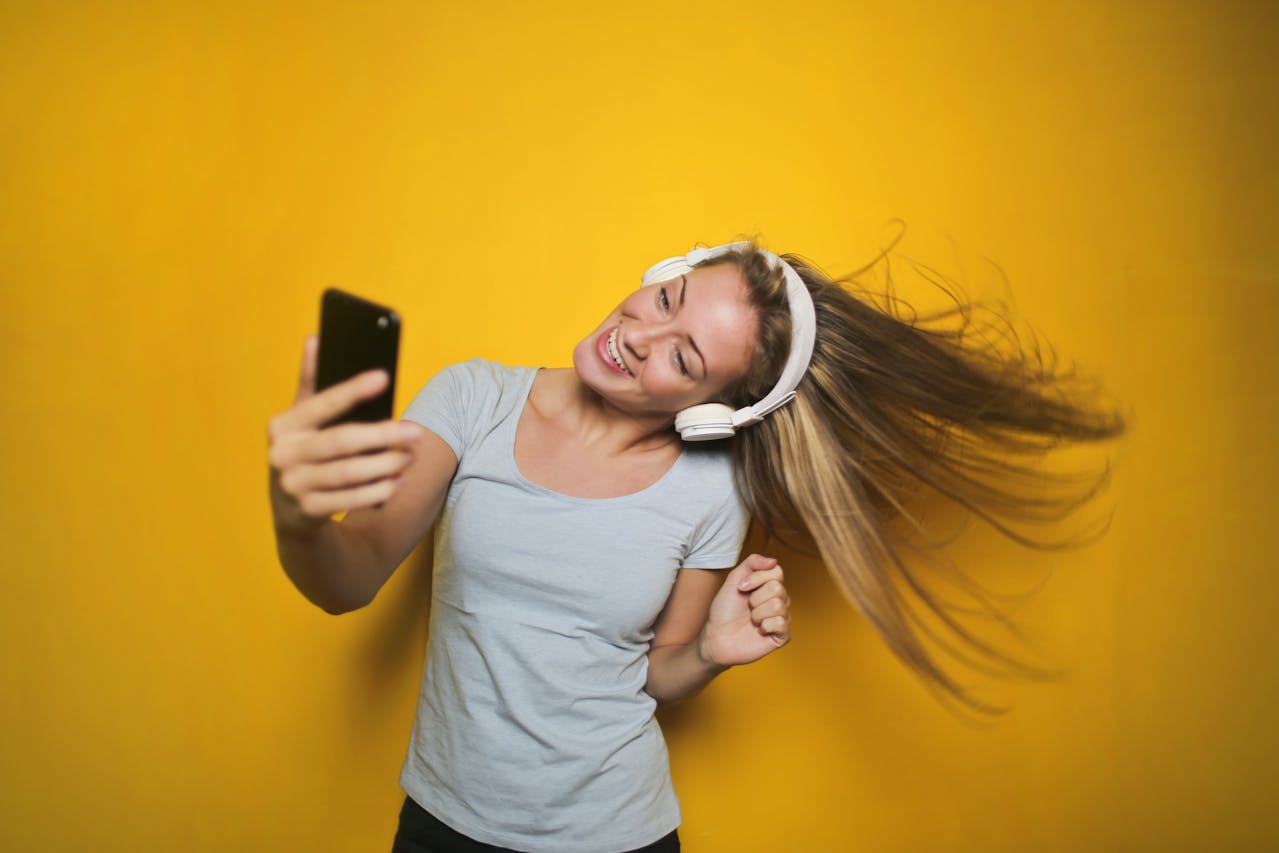 woman taking selfie - Self-Image is the Biggest Predictor of Your Long-Term Health
