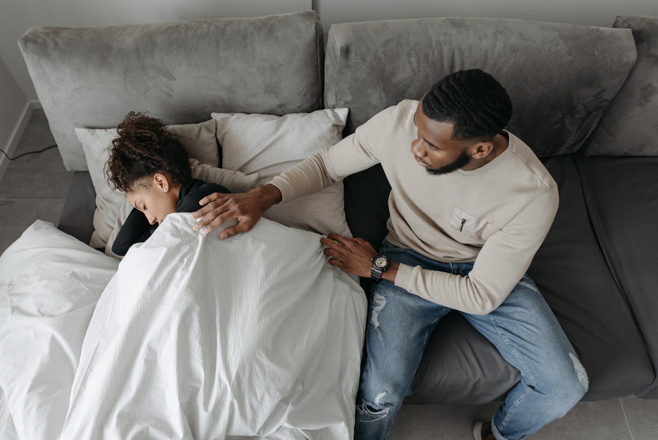 man caring for sick woman - infections when to seek medical care