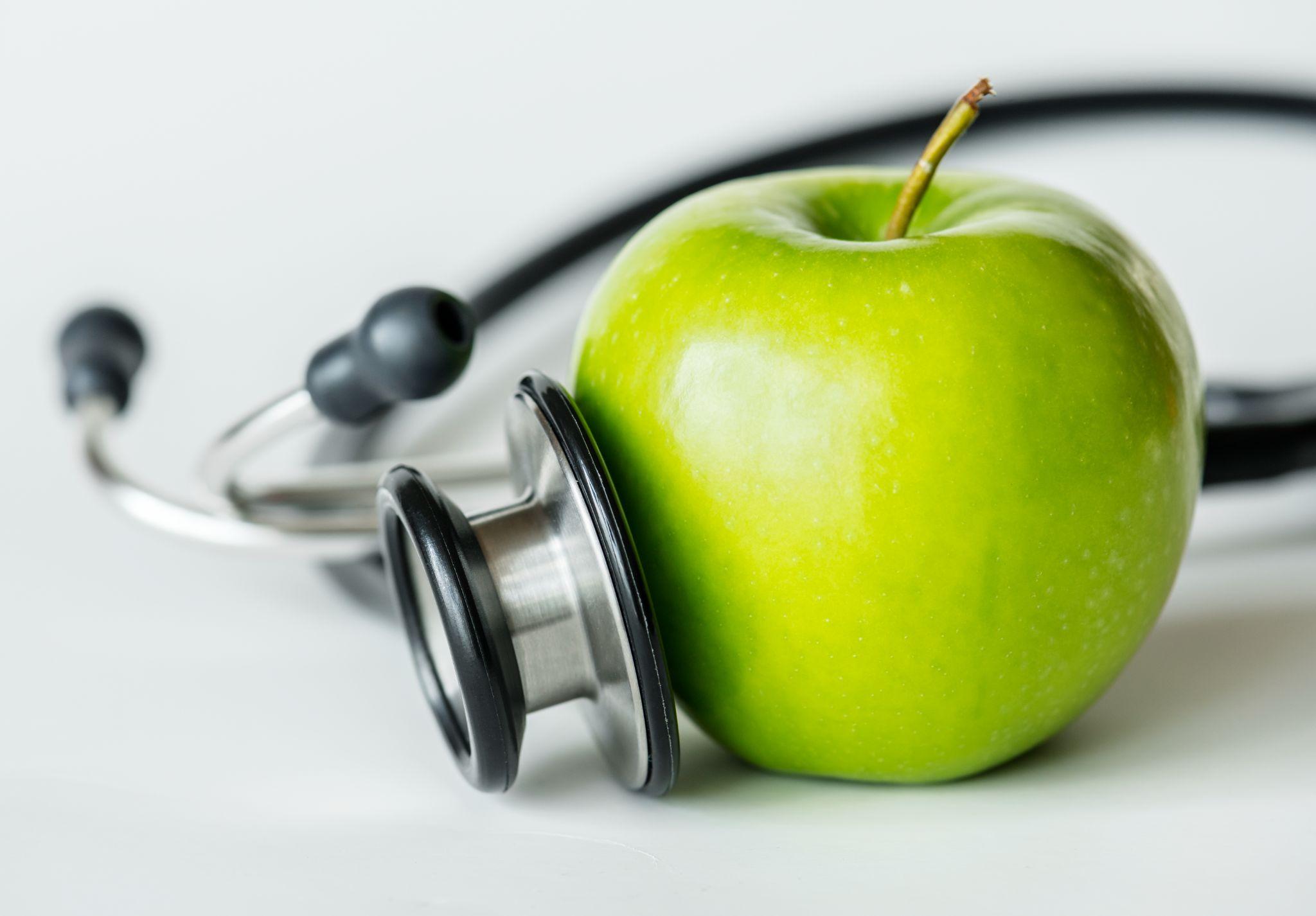 stethoscope next to apple