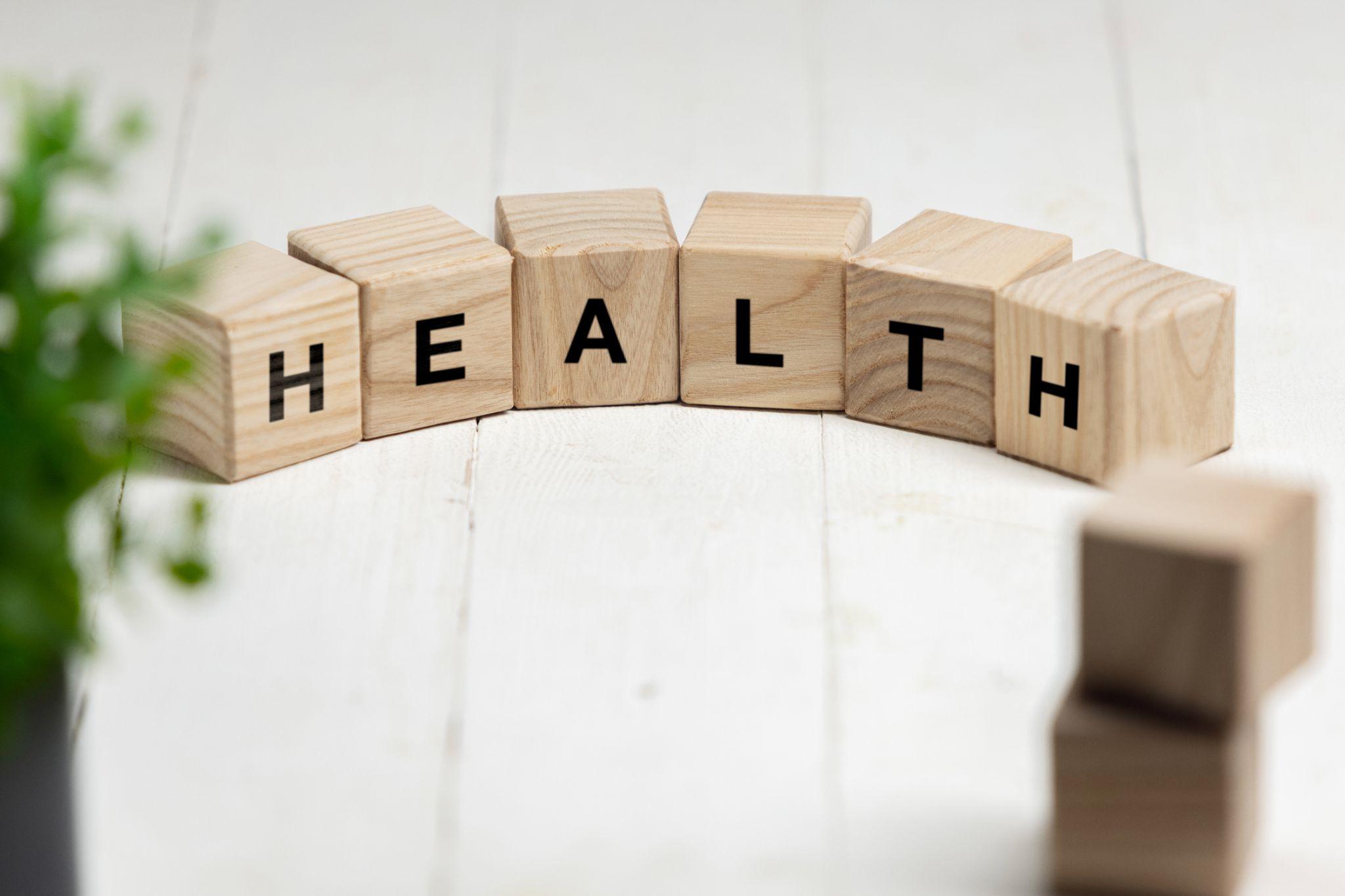 wooden blocks spelling out “health”