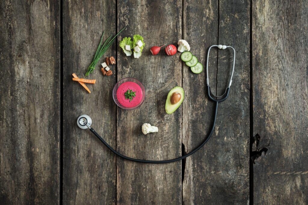 stethoscope and vegetables forming a smiling face, representing wellness without barriers from Direct Primary Care in Humble TX