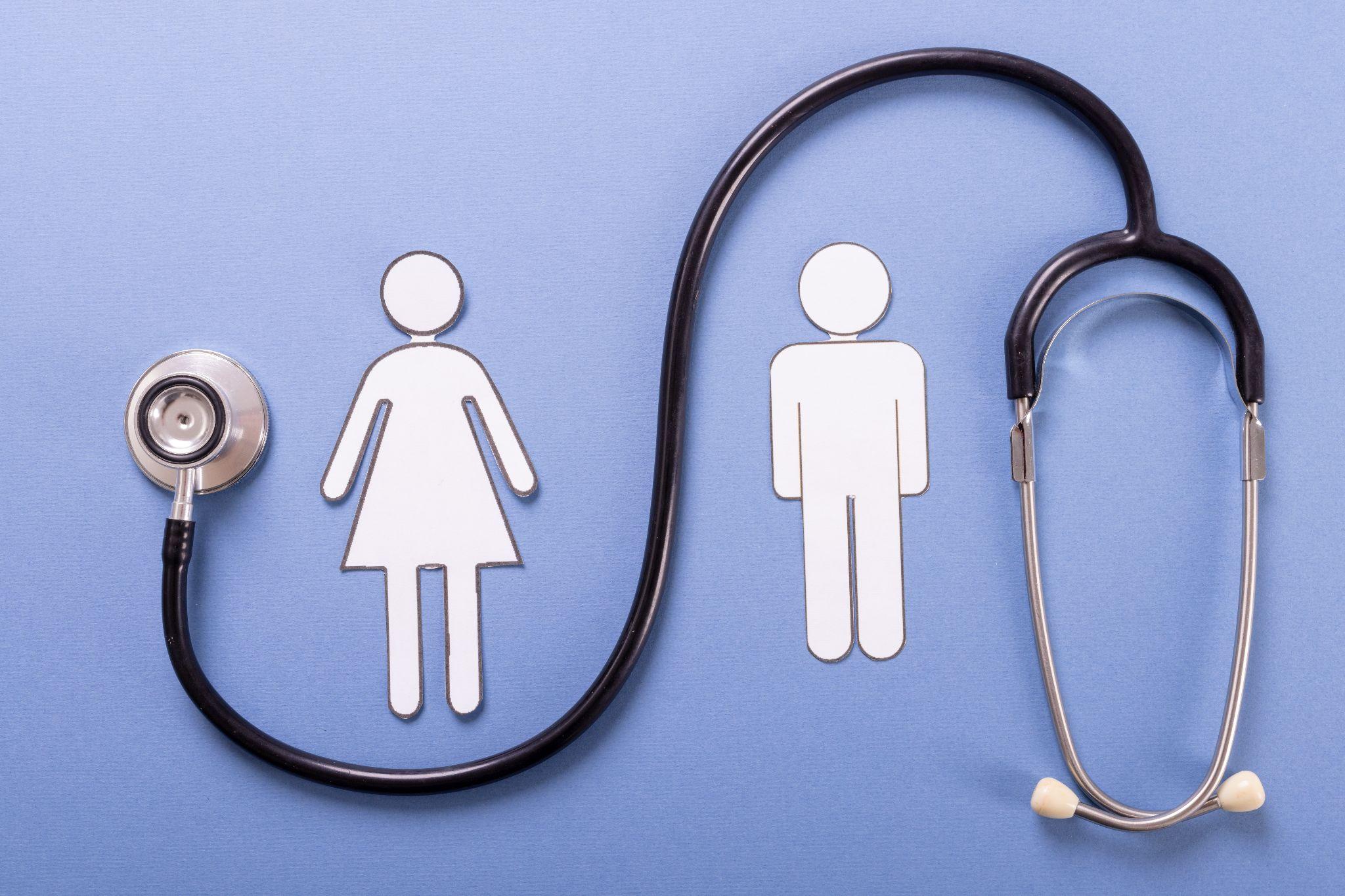 paper cutout of man and woman, with stethoscope around