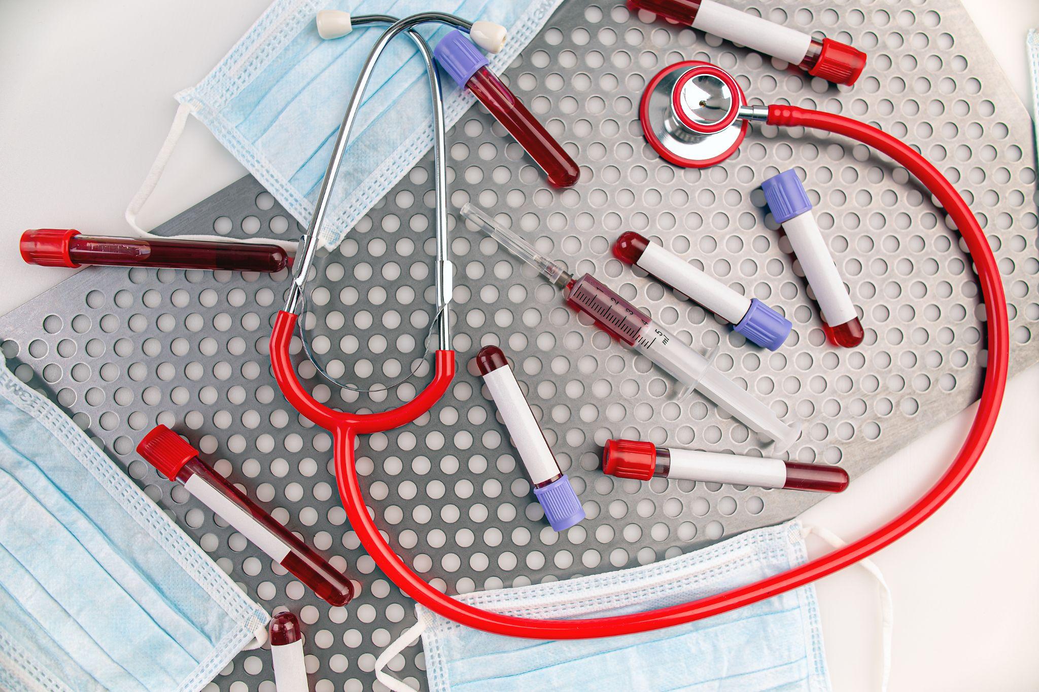 stethoscope, blood samples, and face masks