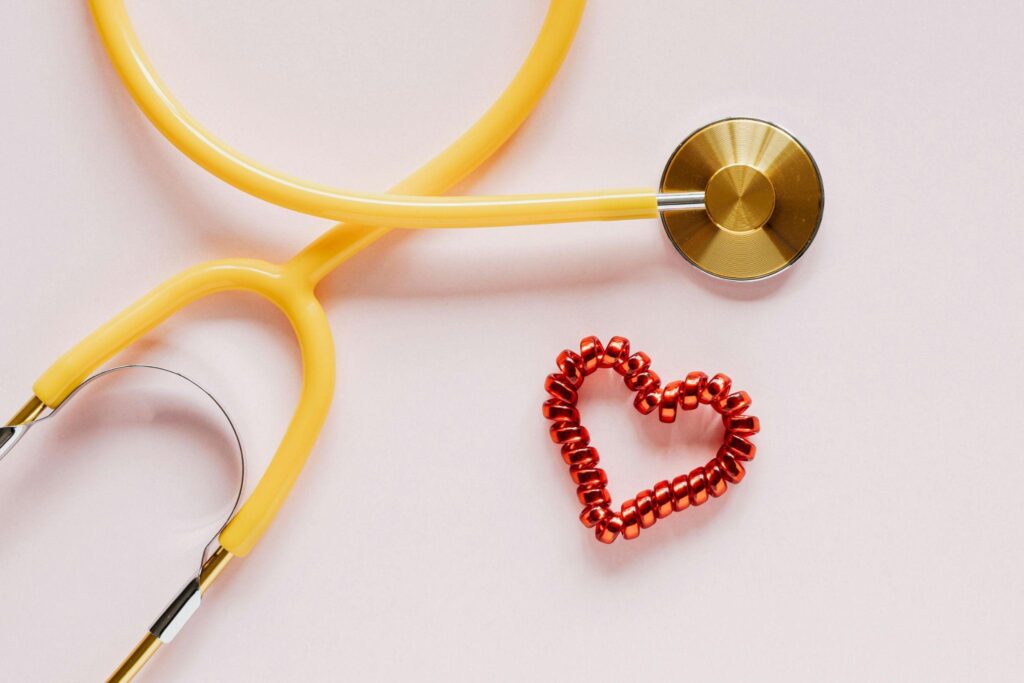 stethoscope and coil hair scrunchie in the shape of a heart, representing personalized preventive care