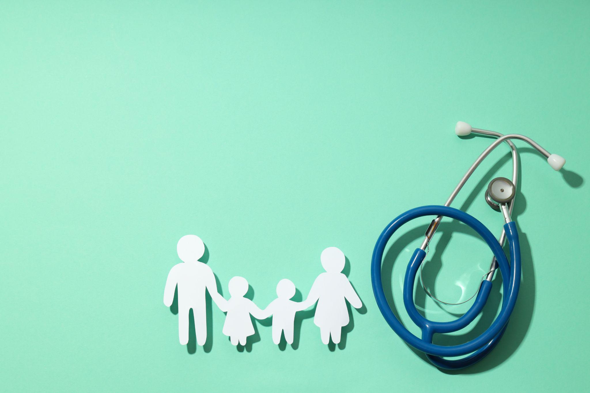 cutout of family next to stethoscope