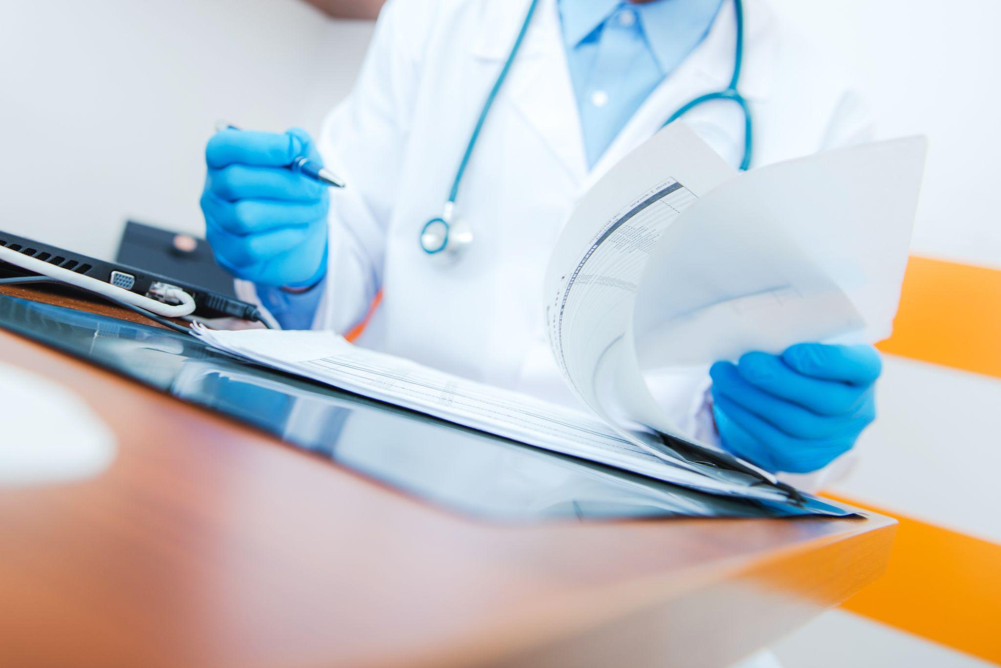 doctor looking at records