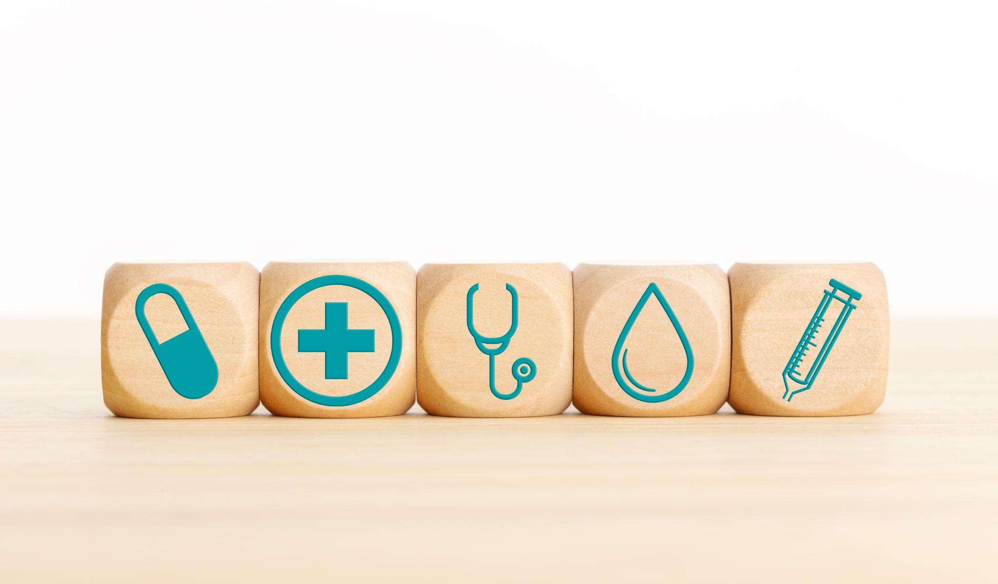 wooden blocks with health-related icons