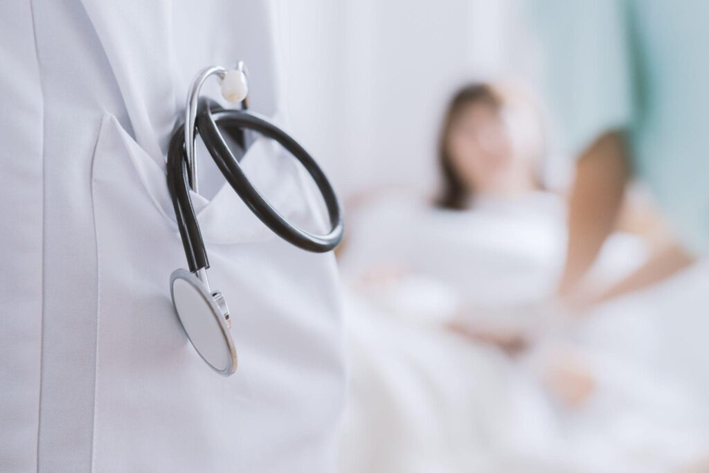 doctor in lab gown, with stethoscope, symbolizing the work of a Humble TX weight loss doctor like Dr. Jordan Salmon