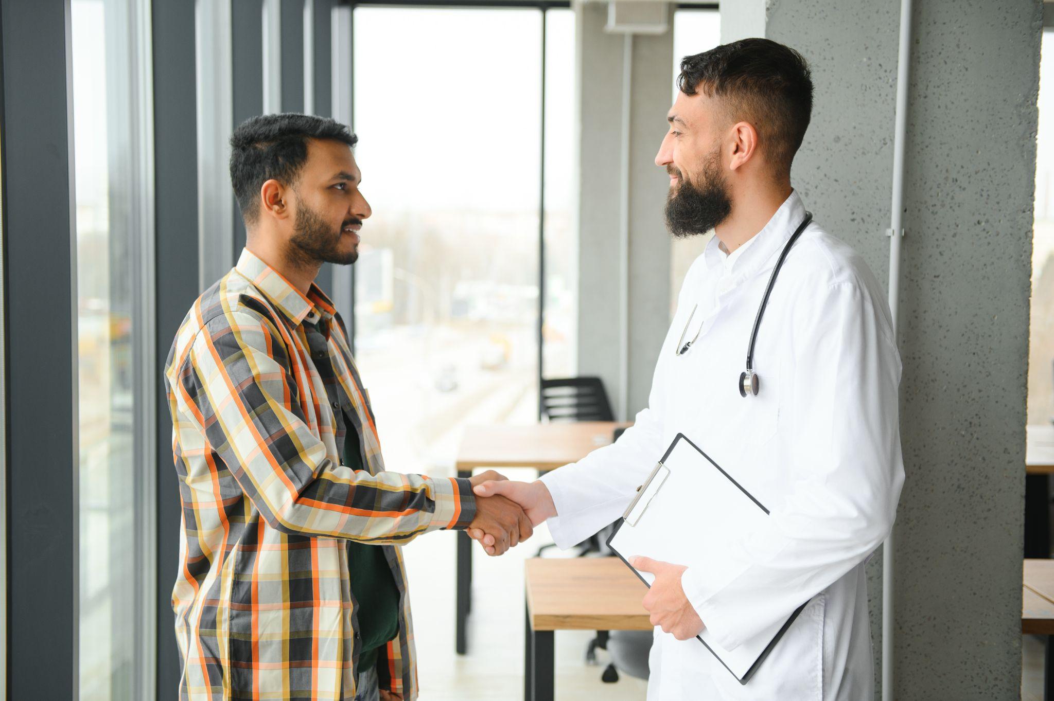 Doctor shaking hands with a patient after a wellness visit in Fall Creek TX.