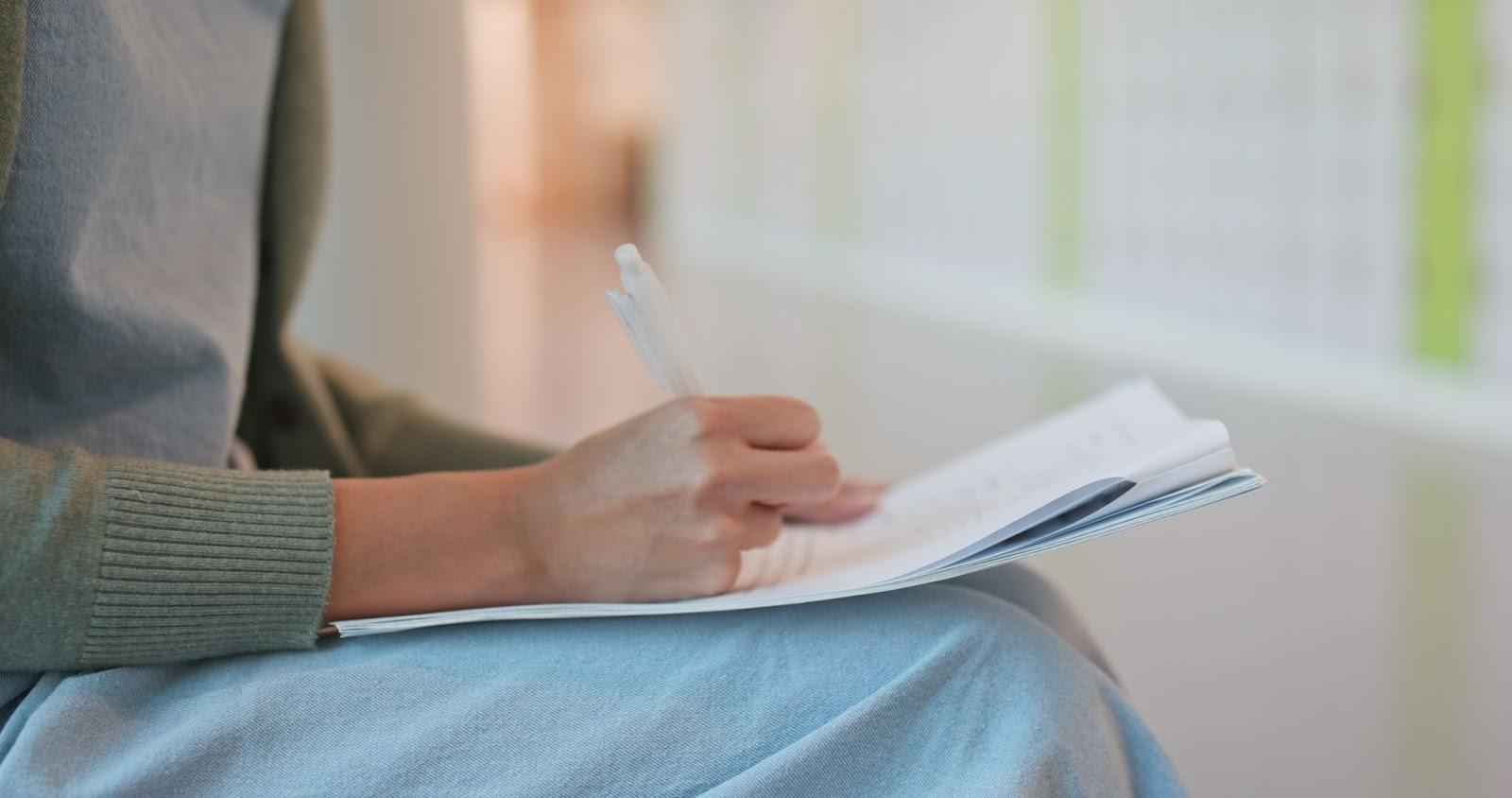 Patient preparing notes before a doctor visit.