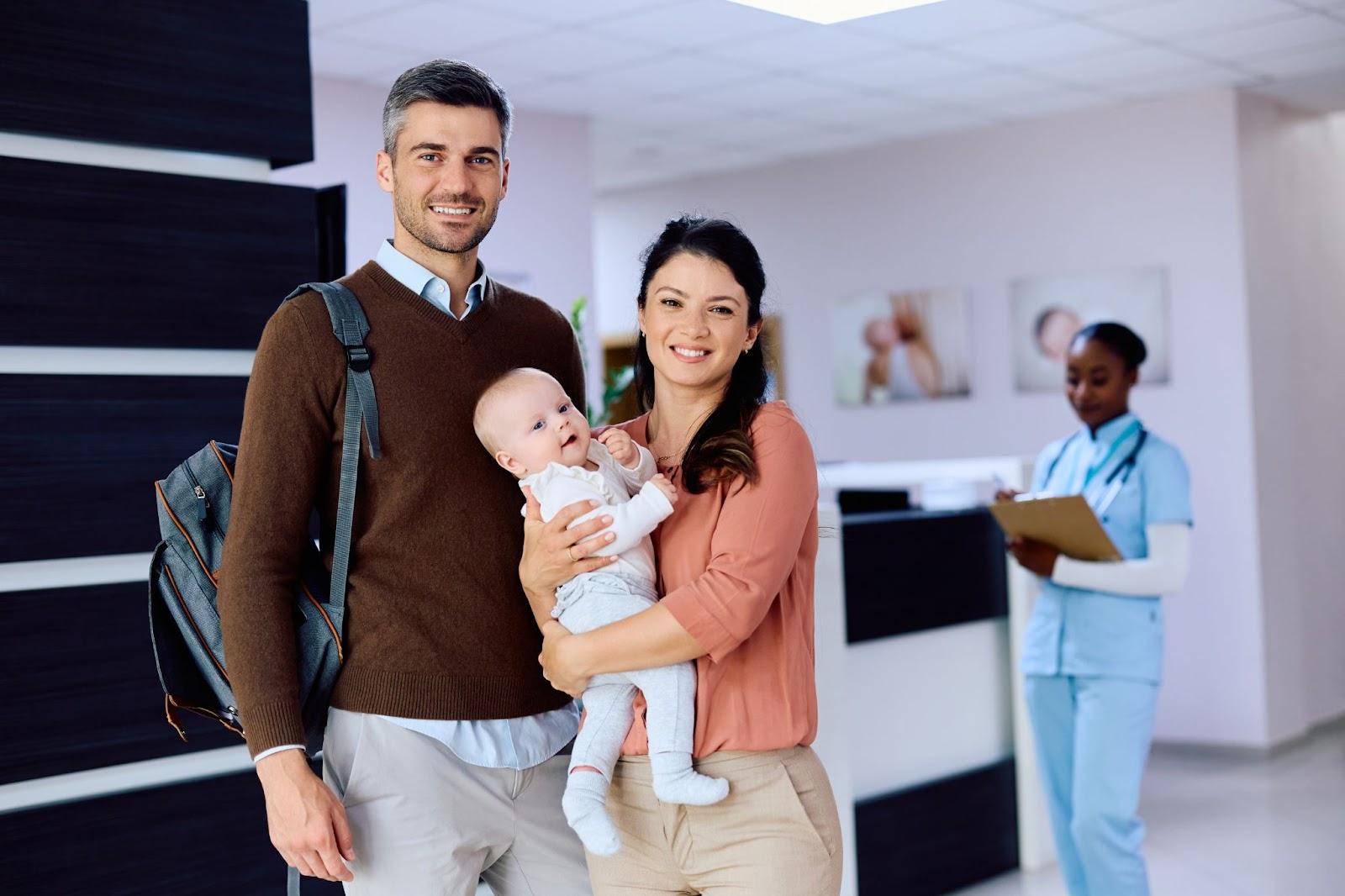 happy family visiting doctor clinic