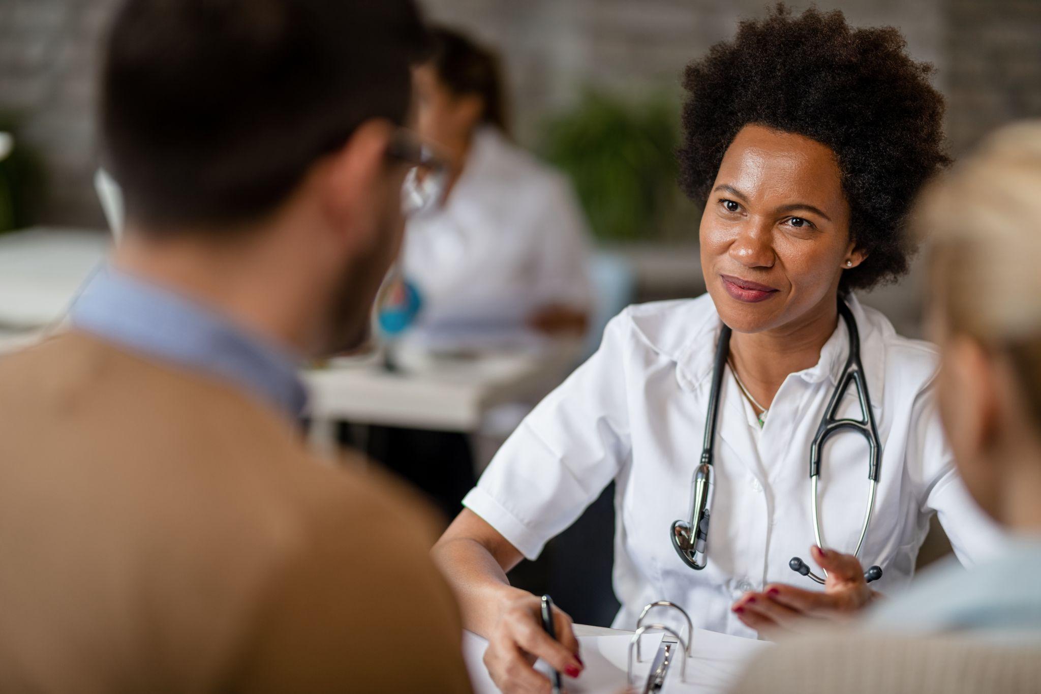 Doctor reviewing care plan during chronic care management.