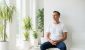 man looking relaxed in waiting room of clinic