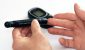 person with glucose monitor - How to Prevent and Reverse Diabetes Naturally