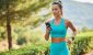 woman jogging while using a smart phone